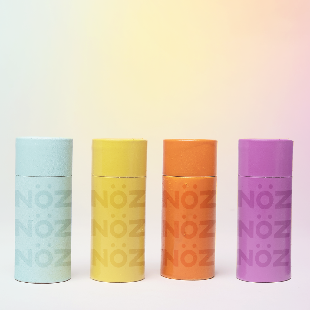 All of the Noz colorful sunscreen in blue, yellow, orange, and purple